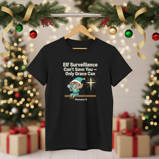 Christian Christmas Tee - "Elf Surveillance Can't Save You — Only Grace Can" (Romans 6)