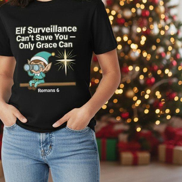 Christian Christmas Tee - "Elf Surveillance Can't Save You — Only Grace Can" (Romans 6)